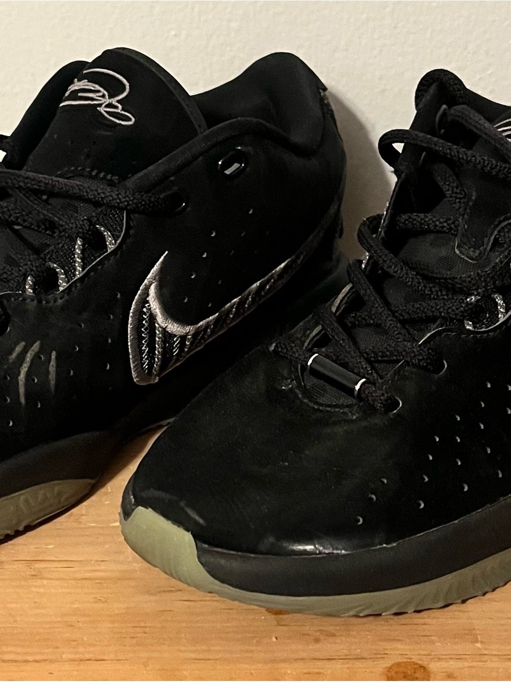 Nike LeBron 21 Black Metallic Green Sneakers with Silver Swoosh Accent
